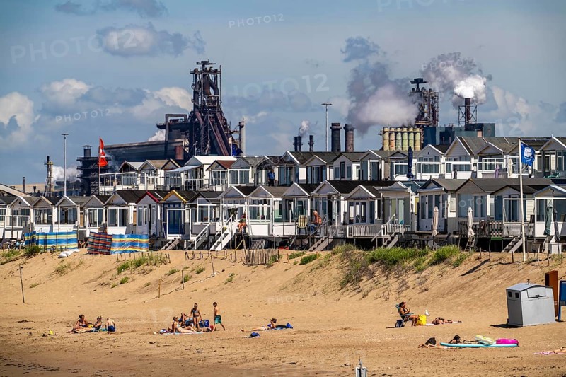 The Tata Steel steel and smelting works in IJmuiden, Velsen, North Holland, Netherlands, largest industrial area in the Netherlands, 2 blast furnaces, 2 coking plants, rolling mills, directly on the North Sea, beach houses near Ijmuiden aan Zee