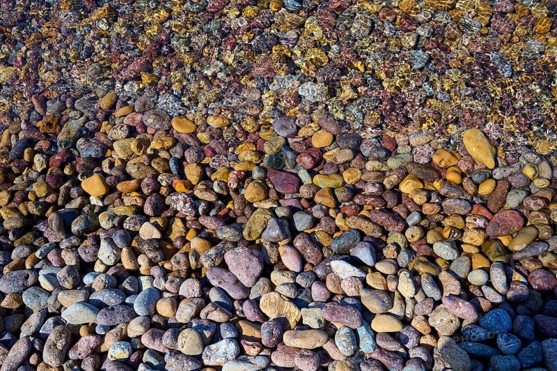 Colourful pebbles on the shore with diverse patterns and textures, Lambi beach, pebble beach, Patmos, Dodecanese, Greek islands, Greece, Europe