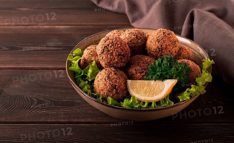 Chickpea falafel balls, on a wooden table, close-up, vegetarian food