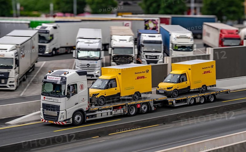 Car transporter with 2 new delivery vehicles for Deutsche Post, DHL, electric vehicles, on the A2 motorway, near Bottrop-Süd, North Rhine-Westphalia, Germany, Europe