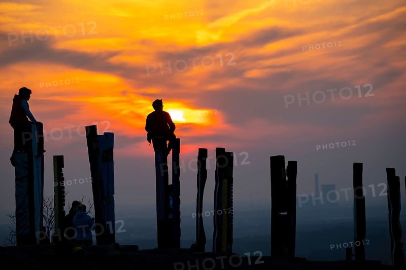 The Haniel spoil tip, 185 metre high spoil tip, at the Prosper Haniel mine, which was closed in 2019, artwork Totems by the sculptor Augustin Ibarrola, sunset, Bottrop, Germany, Europe