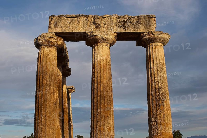 Archaic Temple of Apollo, Doric columns, Imposing ancient columns and architecture against a cloudy sky, Archaeological site, Archea Korinthos, Corinth, Peloponnese, Greece, Europe