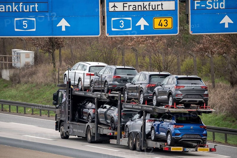 A5 motorway, car transporter with various new VW cars, passenger car