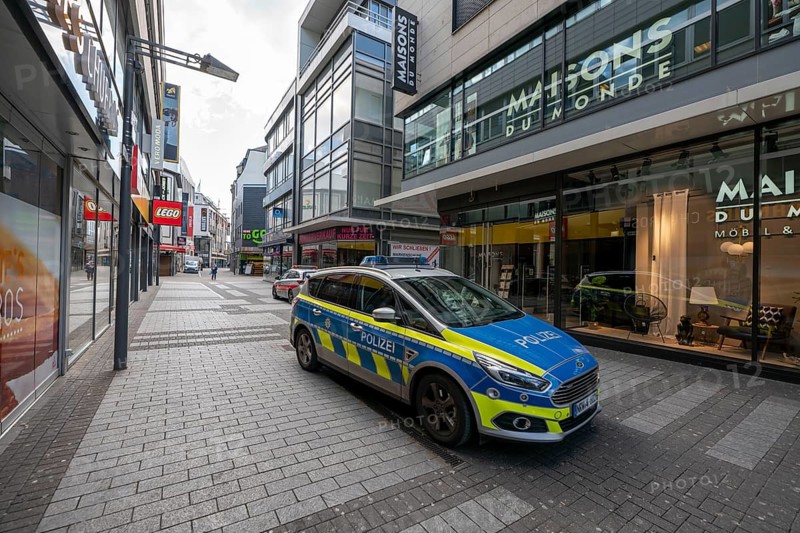 Effects of the coronavirus crisis, empty shopping street, patrol from the public order office and police, around 1400 hours on Saturday, normally thousands of people go shopping here at this time, Hohe StraÃŸe in Cologne, Germany, Europe
