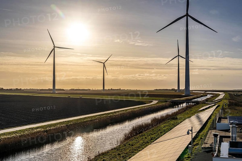 Solar park on the Slaperdijk dyke near the Eemshaven, test project, 17, 000 solar modules were installed over a good 5 kilometres, the Netherlands has over 22, 000 kilometres of dyke line, here it is being tested whether such an installation is successful and can be expanded, wind farm, Groningen, Netherlands