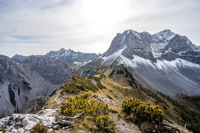 Hiking trail on the ridge of the Hahnkampl, mountain panorama with steep rocky peaks, view of Lamsenspitze peak, in autumn, Karwendel Mountains, Alpenpark Karwendel, Tyrol, Austria, Europe