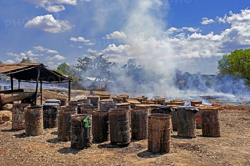Old discarded oil barrels for the production of Toaka gasy, Malagasy rum near Tulear, Toliara, Atsimo-Andrefana region, southern Madagascar