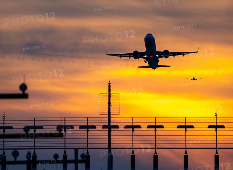 Runway lighting, approach aids, at Düsseldorf International Airport, sunset, aircraft taking off and approaching the southern main runway, 05R/23L, North Rhine-Westphalia, Germany, Europe
