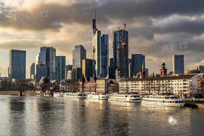 Skyline of the city centre of Frankfurt am Main, river Main, excursion boats at the Mainkai, dusk, Hesse, Germany, Europe