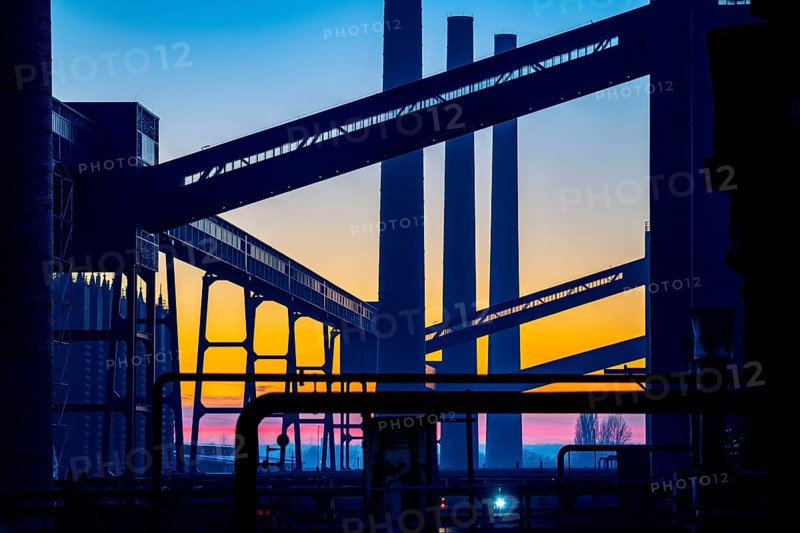 Zollverein Coal Mine Industrial Complex World Heritage Site, Zollverein coking plant, chimneys and conveyor bridges in the evening light, Essen, Germany, Europe