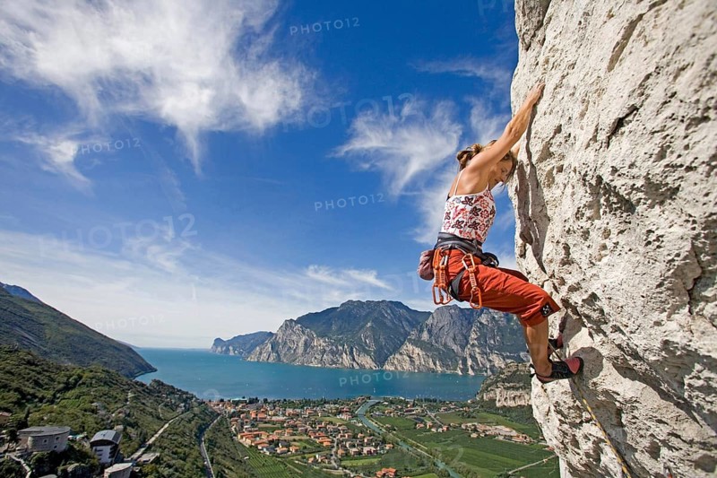 Young blonde fRau climbs on mountain, 35, years