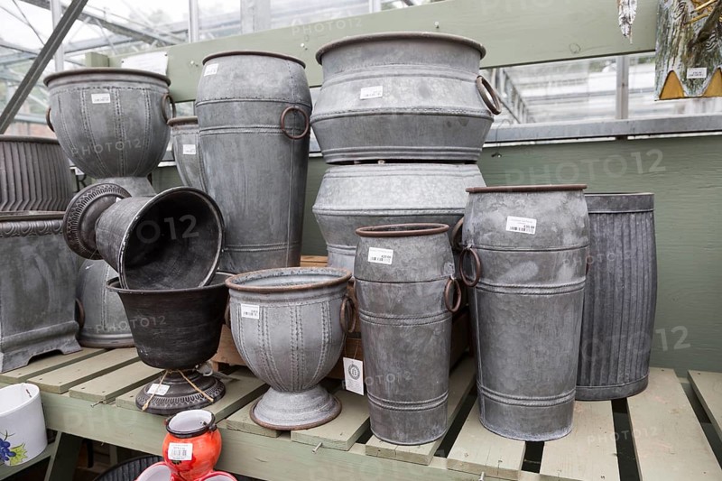 Display of metal planting containers, The Walled garden plant nursery, Benhall, Suffolk, England, UK