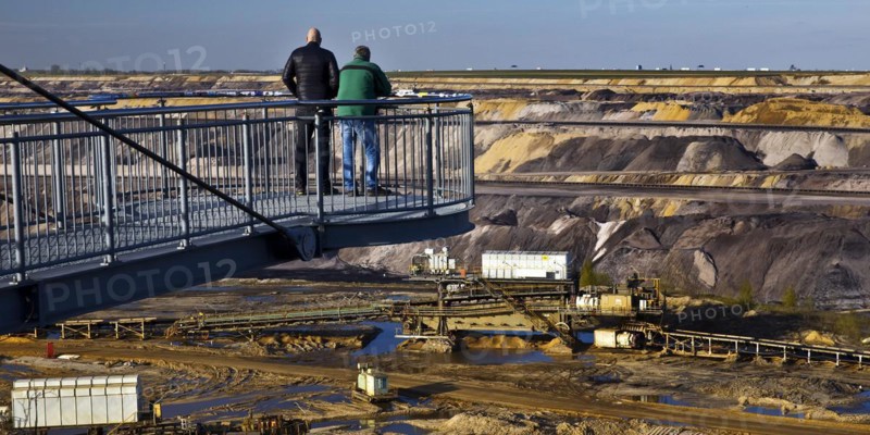 Two men on the Jackerath viewing platform look out over the Garzweiler open-cast lignite mine, Juechen, North Rhine-Westphalia, Germany, Europe