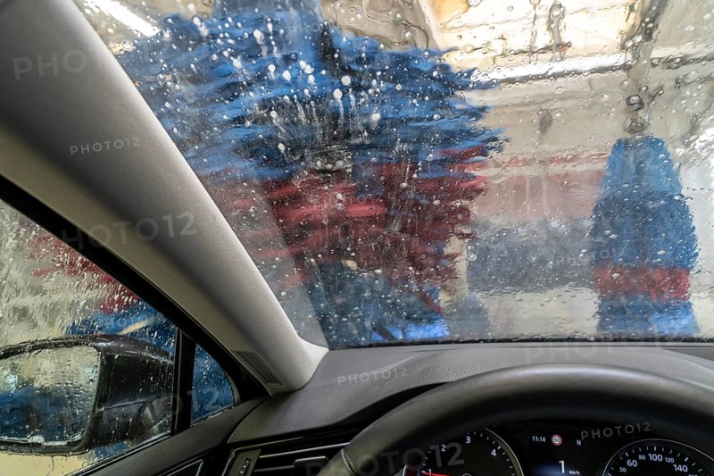 Car in an automatic car wash, car wash tunnel