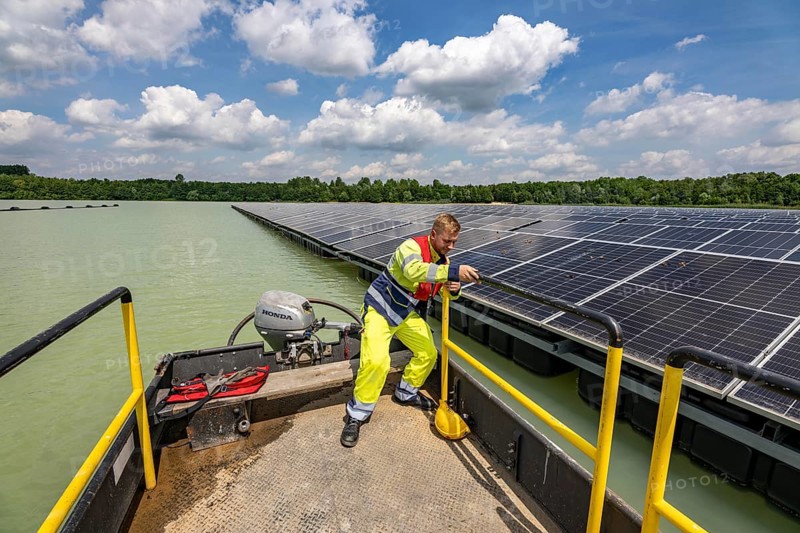 Germany's largest floating solar power plant on the Silbersee III, a quarry pond no longer used for sand mining, near Haltern am See, operated by Quarzwerke GmbH, around 5800 solar modules, on an area of a good 2 football pitches, generate 3.1 megawatts of power, the company uses the electricity itself on weekdays, at weekends it flows into the public grid, North Rhine-Westphalia, Germany, Europe