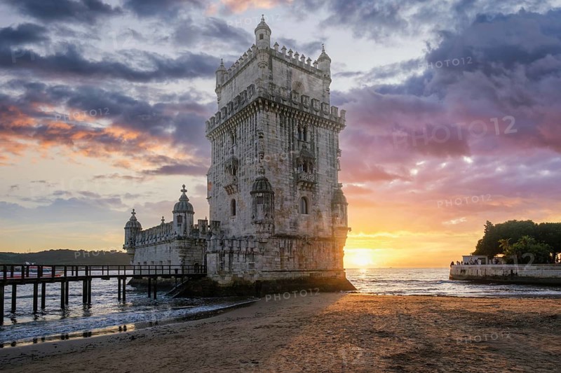 Belem Tower or Tower of St Vincent, famous tourist landmark of Lisboa and tourism attraction, on the bank of the Tagus River Tejo on sunset. Lisbon, Portugal, Europe