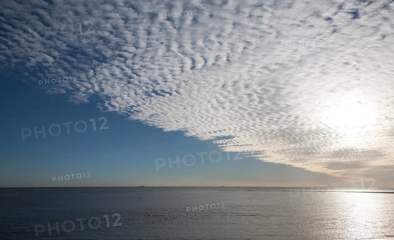 A mackerel sky or buttermilk sky of altocumulus clouds over Shingle Street, Suffolk, England, United Kingdom, Europe