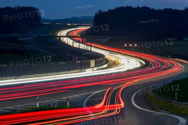 Tracers on the A8 motorway, winding road, evening, long exposure, Swabian Alb, Baden-Württemberg, Germany, Europe