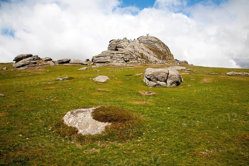 People scrambling on the granite tor of Haytor, Dartmoor national park, Devon, England, United Kingdom, Europe