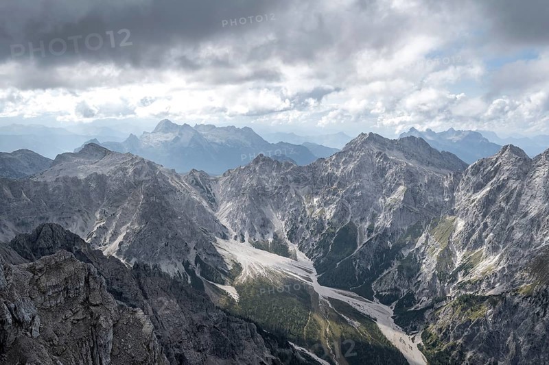 View of Wimbachgries valley and mountain panorama with rocky mountain peak of Hochkalter, at Watzmann Hocheck summit, Berchtesgaden National Park, Berchtesgaden Alps, Bavaria, Germany, Europe