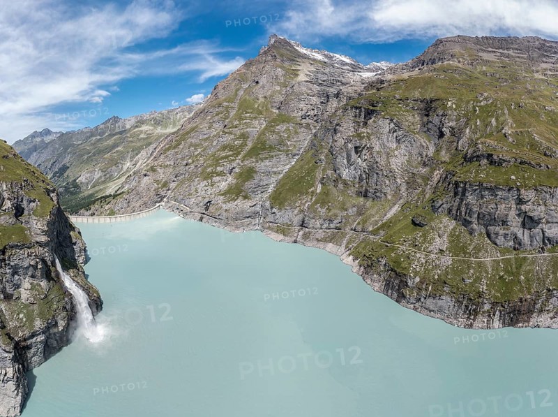 Panorama aerial view of lake Mauvoisin, artificial channels in the rock fill the lake, valley Val de Bagnes, Valais, Switzerland, Europe