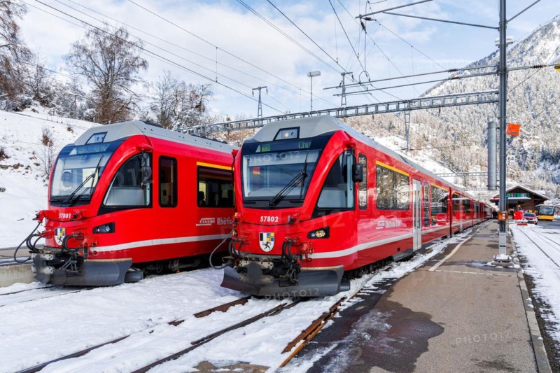 Rhaetian Railway trains on the Albula railway Stadler Rail passenger train at Filisur station, Switzerland, Europe