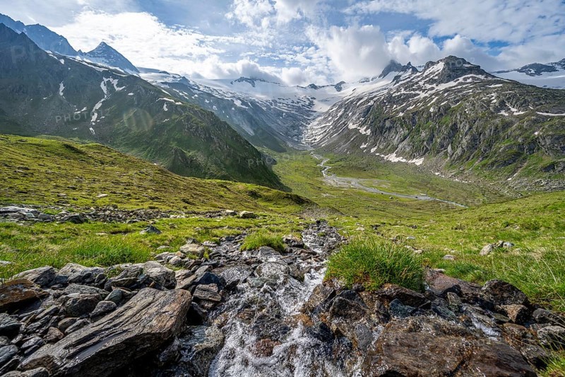 Picturesque mountain landscape with mountain stream, mountain summit with snow and glacier Schwarzensteinkees, summit GroÃŸer Mörchner and Schwarzenstein, valley Zemmgrund with Zemmbach, Berliner Höhenweg, Zillertal Alps, Tyrol, Austria, Europe