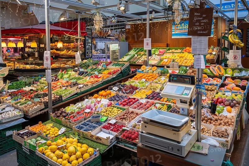 Market stall with a wide range of different tropical fruits and vegetables in the Markthalle Stuttgart, Baden-Württemberg, Germany, Europe