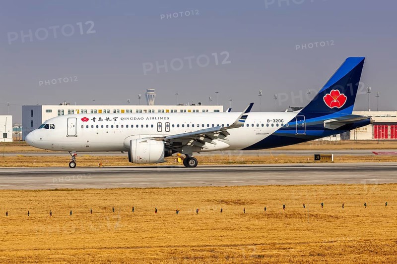 An Airbus A320neo aircraft of Qingdao Airlines with the registration number B-320C at Daxing Airport (PKX) in Beijing, China, Asia