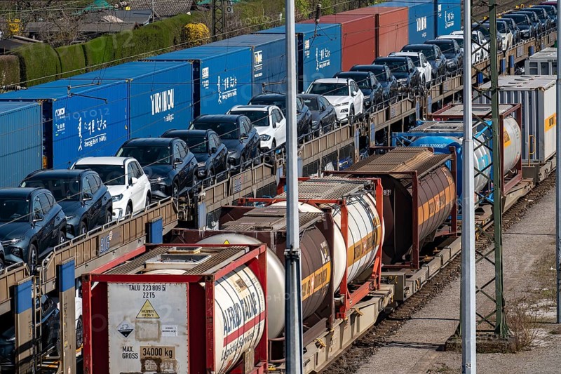 Duisburg-Rheinhausen freight station, at the Logport harbour area, goods trains loaded with new cars, various tank containers and the container train from China, on its way to the Logport, part of the new Silk Road, Duisburg, North Rhine-Westphalia, Germany, Europe