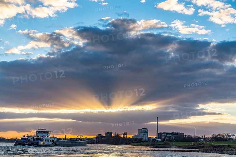 Cargo ship on the Rhine between Duisburg and Krefeld, dramatic sunset, North Rhine-Westphalia, Germany, Europe