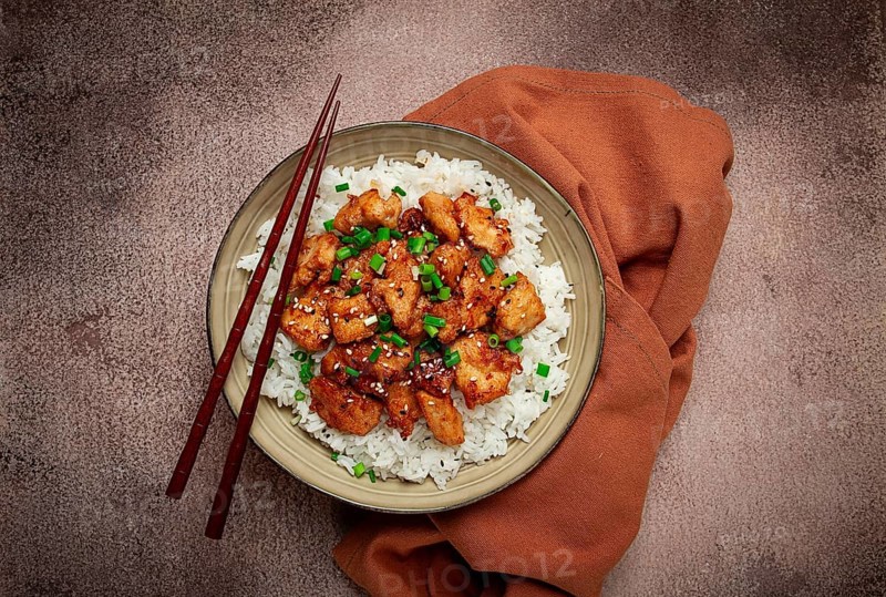 Fried chicken teriyaki with rice, green onion and sesame, homemade, no people
