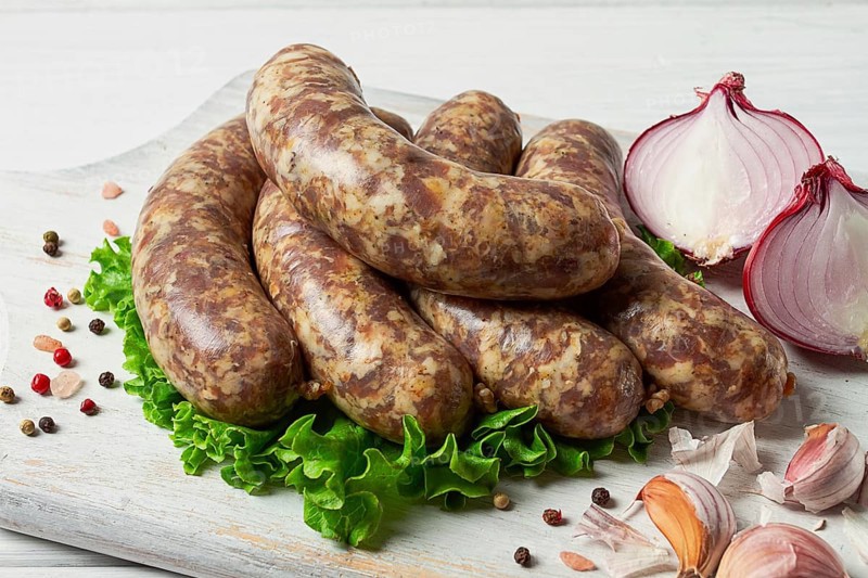 Raw kupaty, traditional Georgian sausages, raw sausages, with spices and herbs, Georgian cuisine