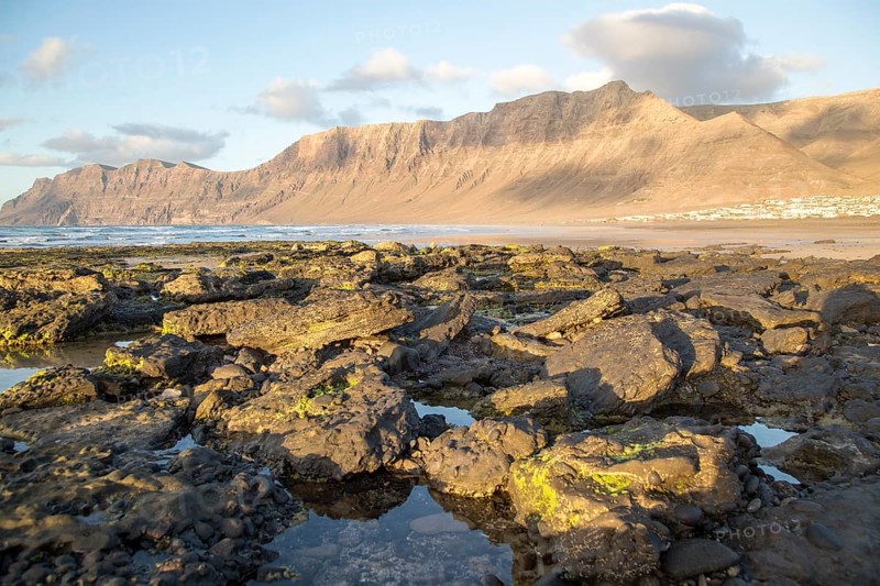Lanzarote, Canary islands, SpainLate afternoon light on beach and cliffs La Caleta de Famara, Lanzarote, Canary islands, Spain, Europe