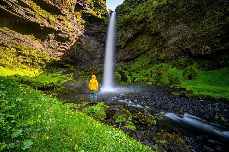 Tourist at Kvernufoss waterfall, in summer when the weather is nice, gorge and river, long exposure, Skogar, Sudurland, South Iceland, Iceland, Europe