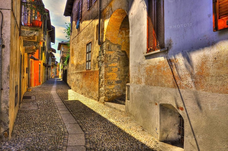 Old Beautiful Narrow Stone Alley in a Sunny Day in Cannobio, Piedmont, Italy, Europe