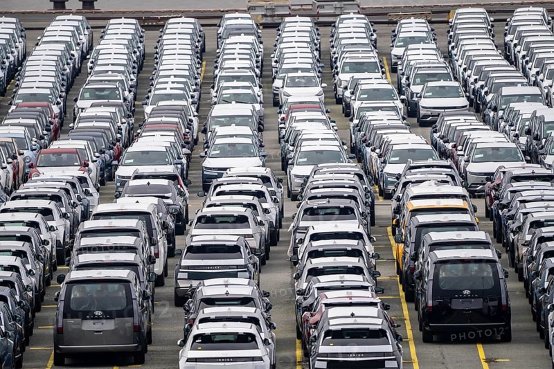 Parking space for import vehicles, hundreds of Hyundai Ioniq, electric cars, waiting for onward transport, at the EUROGATE container terminal in the overseas harbour of Bremerhaven, Lower Saxony, Germany, Europe