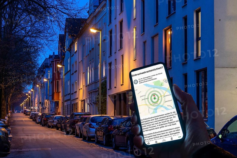 Symbolic image residential burglary, burglary radar app, MehrWetter app, shows the burglaries in the city, the last few days, residential street, many apartment buildings in a residential neighbourhood, evening, lantern lighting, Essen, North Rhine-Westphalia, Germany, Europe