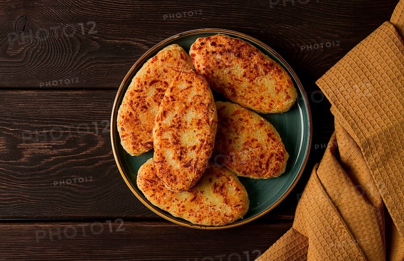 Chvishtari, corn flour tortillas with cheese, pastries, Georgian cuisine, Mchadi, homemade, top view, on a wooden table, no people