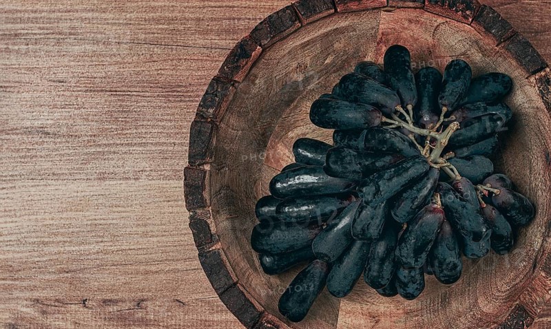 Bunch of black grapes, kishmish variety, black finger, ophelia, Annushka