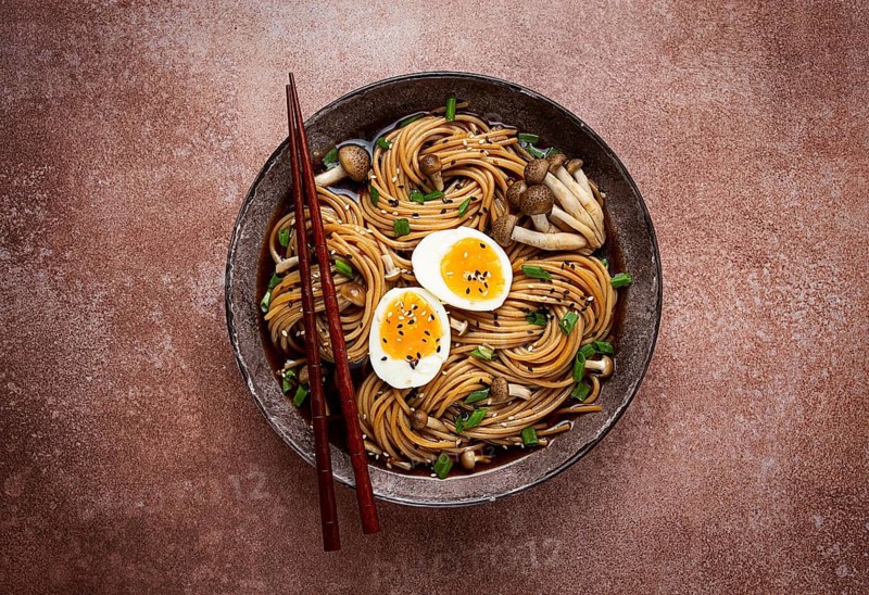 Buckwheat noodles, soba, with shimeji mushrooms, boiled egg, green onion, sesame seeds, homemade, no people