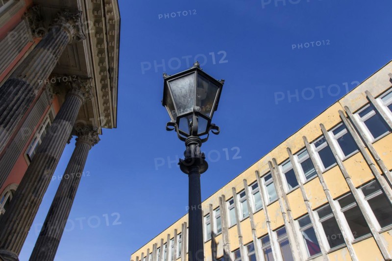 An old lantern stands between a prefabricated building of the Potsdam University of Applied Sciences and the old Potsdam City Palace on the old market square, 22/09/2016