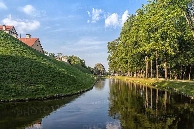 Ancient restored castle with a moat in the Nesvizh city. Belarus
