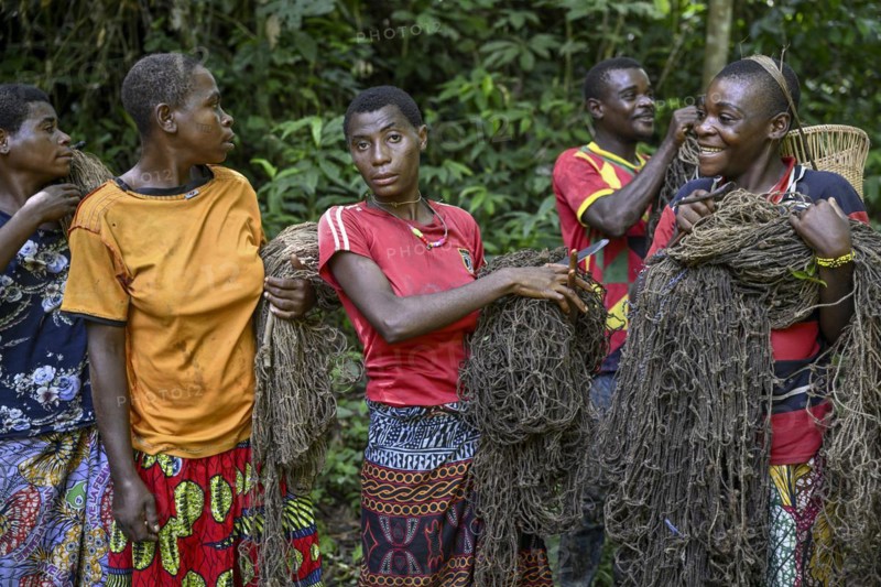Pygmy woman of the Baka or BaAka people with their hunting nets, Dzanga-Sangha Special Dense Forest Reserve, Sangha-Mbaéré Prefecture, Central African Republic, Africa