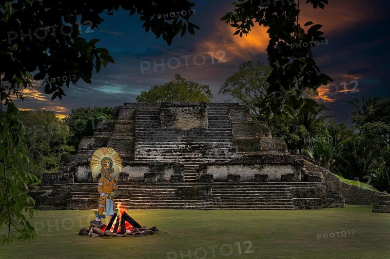 Maya at campfire in front of pyramid Altun Belize Central America Fire Via KI Maya built in