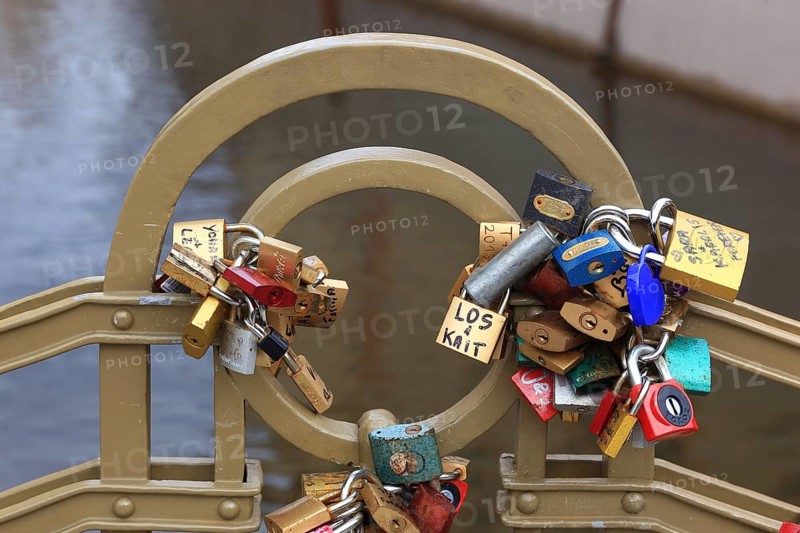 Lover's lock on a railing, love lock is a padlock which, according to custom, is attached to bridges by lovers to symbolically seal their eternal love, Prague, Czech Republic, Europe