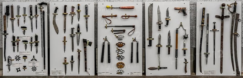 Prohibited weapons seized by the police, cutting and stabbing weapons, knives, machetes, switchblades, brass knuckles, batons, a representation of the police