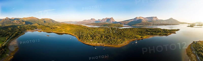 Panoramic aerial view over the fjord Efjord south of Narvik, seen at sunset, leisure boats anchor, holiday huts, calm sea, Norway, Europe