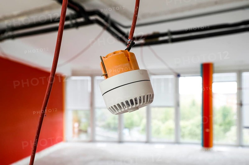 A smoke detector hanging on a wall for mounting, Berlin, 15/04/2024, Berlin, Berlin, Germany, Europe