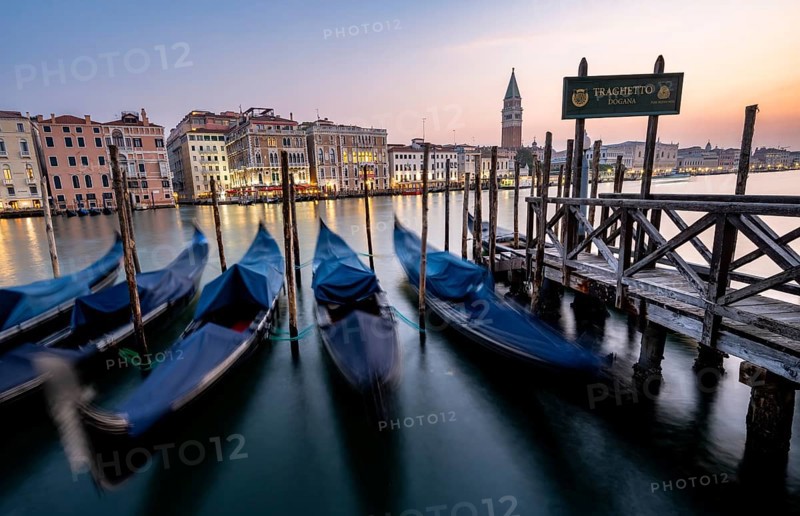Venetian gondolas, boat dock at the customs office on the Grand Canal, Gondola Traghetto Dogana, Campanile behind, long exposure at sunrise, Venice, Veneto, Italy, Europe
